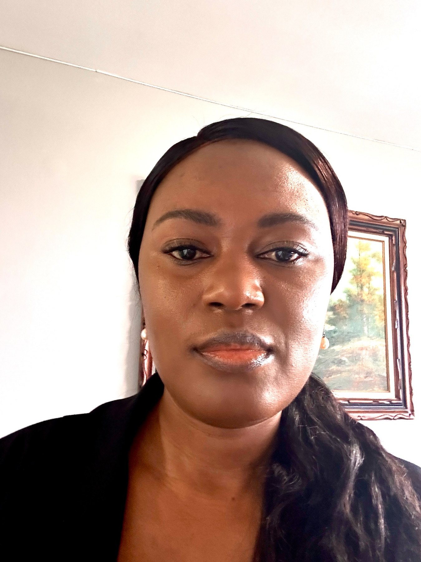 Joedian Reid in professional black attire